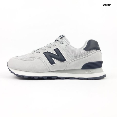 New Balance 574 світло сірі з синім  716569102882 фото